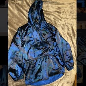 Obermeyer vintage skiwear. Wind breaker. Has shoulder pads. Small venting holes.